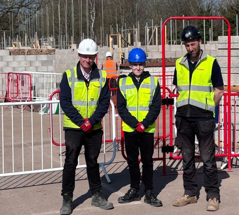 Stoke on Trent College T Level learner Aaron Mollart (centre) pictured on-site with members of staff at Seddon Construction.