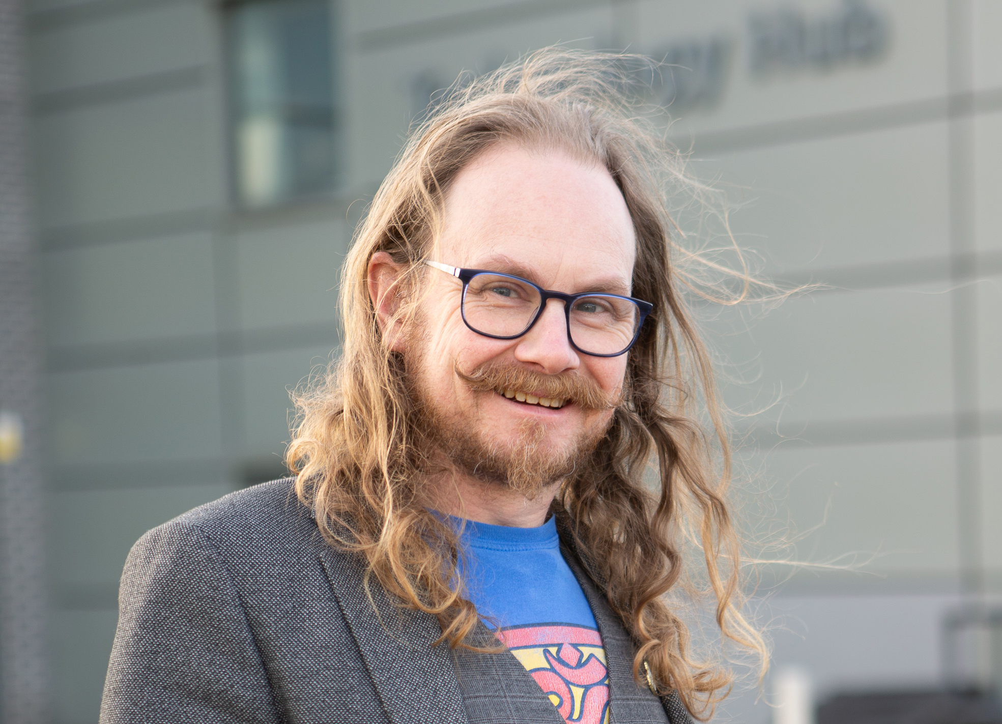 Mechatronics and Engineering lecturer Craig Melville, standing in front of Technology Hub Building at Stoke on Trent College's Burslem campus.