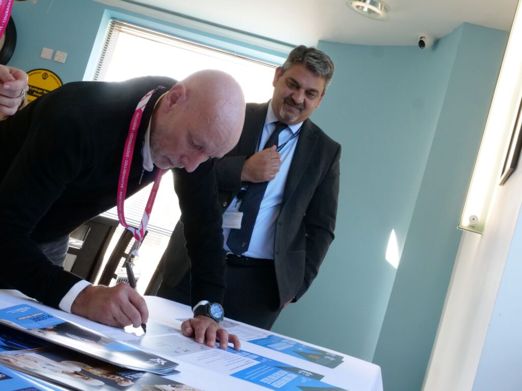 Quantum Group signing their Skills Pledge certificate