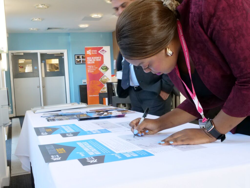 SureCare Stoke signing their Skills Pledge certificate